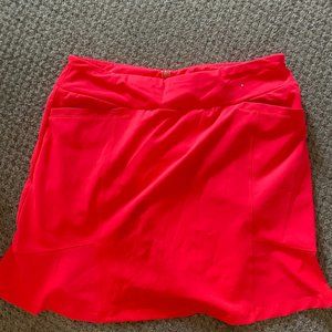 Neon pink golf skort